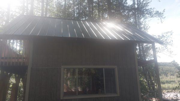 New metal roof, trim, decks, stairs