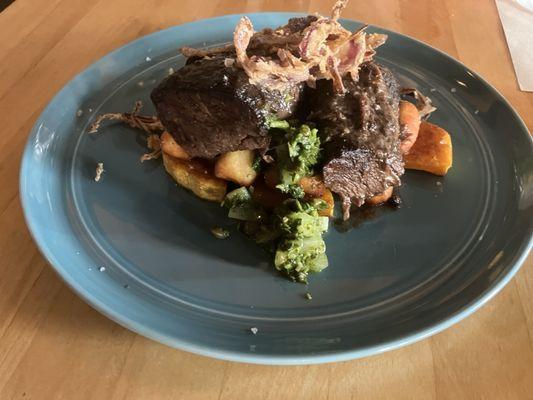 Carne Di Manzo - braised grass fed hanger, steak, crispy gnocchi, roasted squash, crispy, onions, & Italian salsa Verde.