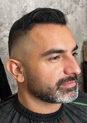 Gentleman's cut with a mid skin fade on the sides