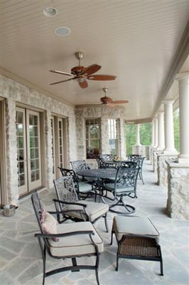 Porch with stone floors and bead board ceiling