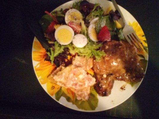 Fresh gardon mix salad w/biold egg bacon and grilled mushrooms. Stawberry glazed pork chop w/ sliced cremcheese añd berry mix bagel.