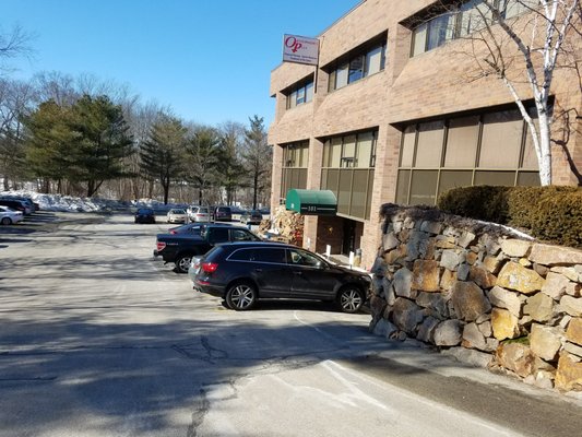 Main entrance through the green awning