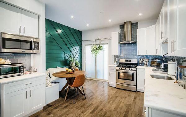 Stunning feature wall and chef's kitchen in this 3-story new construction in booming Brewerytown