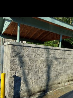 A commercial trash enclosure with roof addition for apartment building