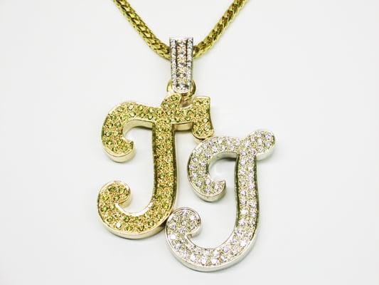 custom letter charm with over 7CTW in diamonds