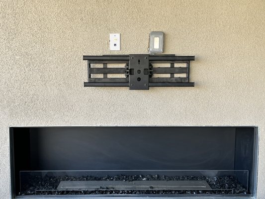 Full motion TV mount installed outside.