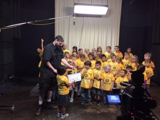 Local Students visited our studios for a field trip, and sang songs for a community news story.