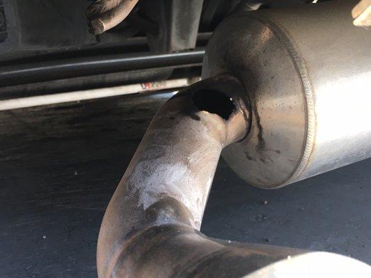 Hole in exhaust tailpipe.