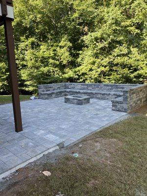 Sitting wall/bench, fire pit, paver steps, paver patio.