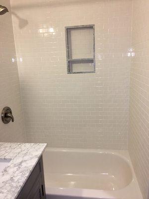 After the completion of tiles the bathroom walls and installation of bathtub.