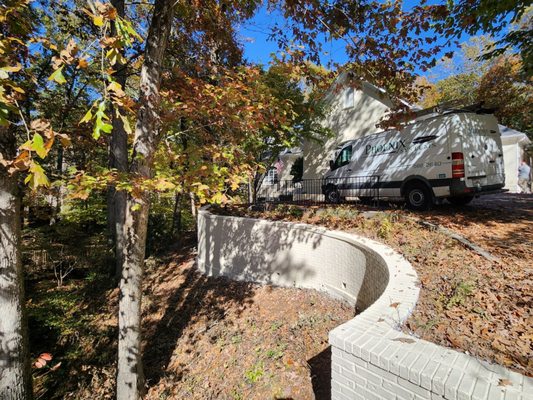 The bricks painted (retaining wall and the entire house  exterior bricks painted)