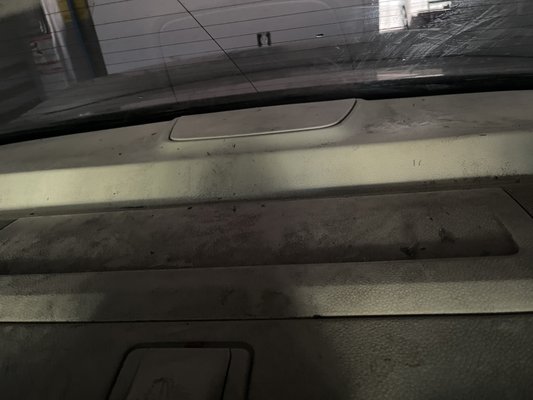 (Back of car) tint not properly laid, black residue everywhere, and back glass not cleaned up after installation