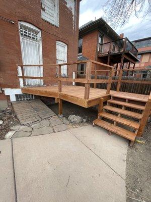 Deck re-build, patio renovation, new decking built with pressure treated lumber and stained with transparent Cedar.