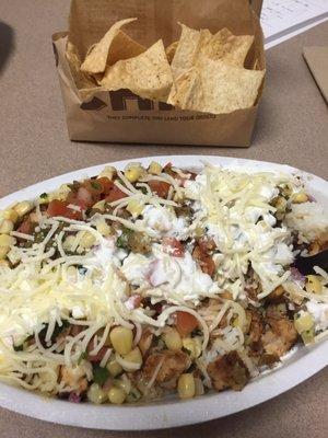 Chicken bowl and half portion of chips. Come on fill the bag!