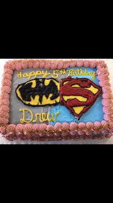 Custom made Batman vs. Superman 1/2 sheet ice cream cake! The Batman and Superman logos are custom made with melted chocolates!