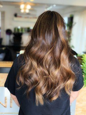 Natural Black turned into honey and caramel using balayage and baby lights