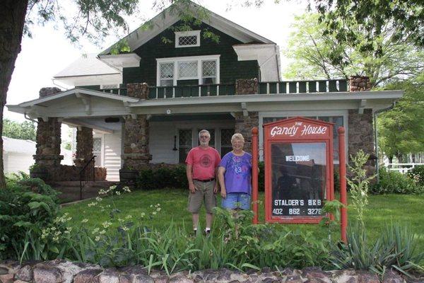 Duaine & Sandy Stalder in front of Gandy House Bed & Breakfast