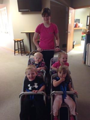 Toddlers out for a stroller ride. Lots of love at Canaland.