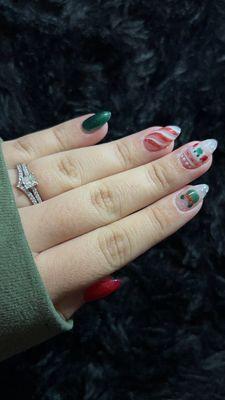 Short almond GelX nails Disney Christmas themed