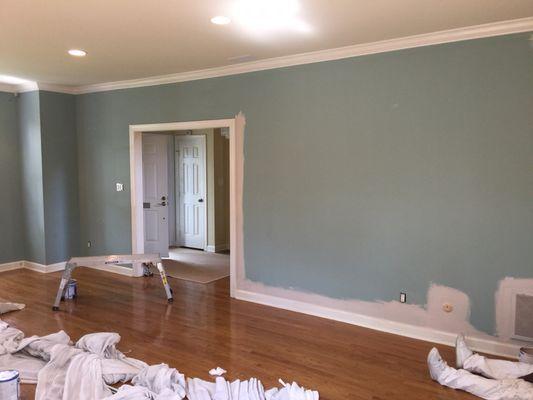 Before picture of living room walls being painted