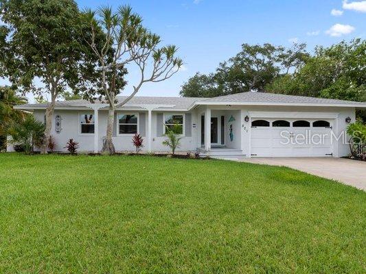 Totally renovated canal front home, Siesta Key, new salt water pool with outside living space galore, from putting green to wide screen TV