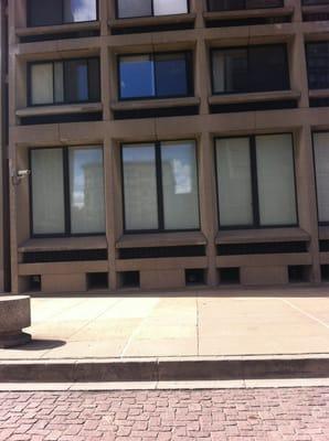 The Cable building is reflected in the first-floor windows of Silver Towers--a complex designed by I.M. Pei.