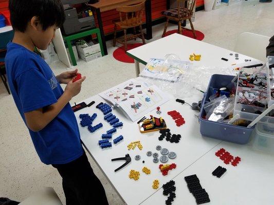 Young engineer organizing all components and parts.