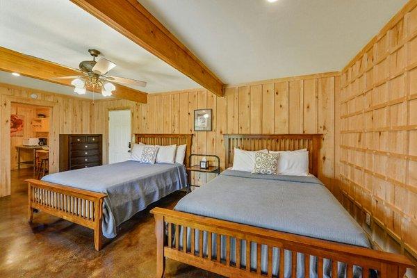 Garden Room, has 2 queen size beds,  kitchenette, bathroom with shower  and porch. Sleeps 4