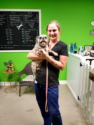 Co-founder and groomer Martha Chavious, holding GoGo.