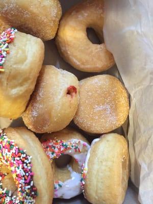 Same types of donuts with little toppings