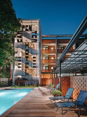 Pool and stair tower at the Carpenter Hotel in Austin, TX. Adaptive reuse, new building architect, and interior design.