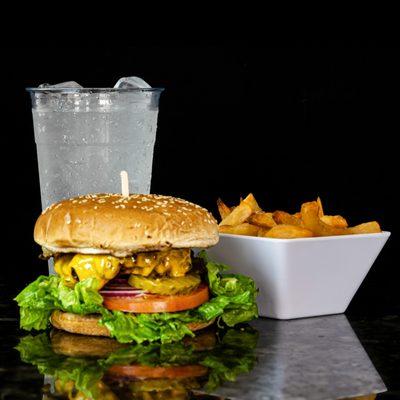 Big Deluxe - 1/3 lb. beef patty topped with melted cheddar cheese, ketchup, mustard, mayonnaise, lettuce, tomato, and onion on a toasted bun