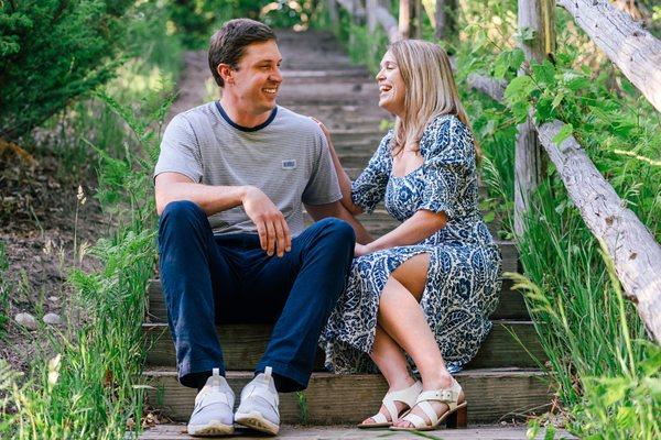 A couple laughing during their engagement photos