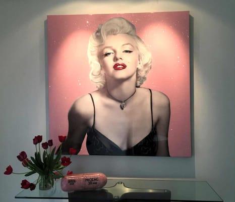 Marilyn - Love of Diamonds by Devon Surrounded by a pink background covered in Diamond dust. Marilyn seems to emerge from the canvas!