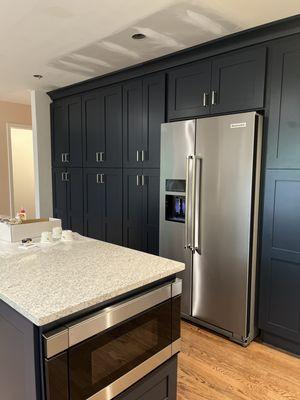 We love the wall of cabinetry and our matching island-kitchen is nearly finished.