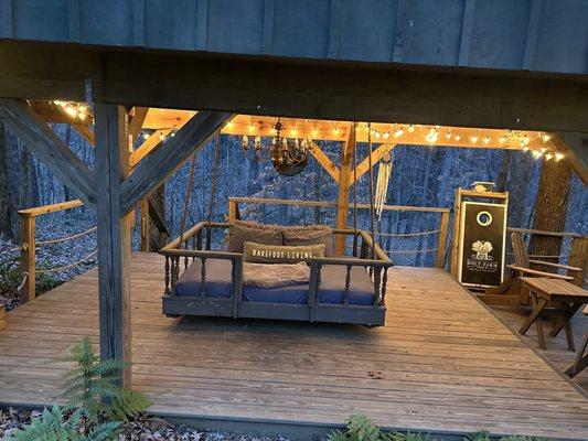 Swinging bed under the treehouse