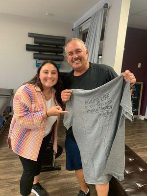 PT Julie with a patient and his new Physiofixx Shirt!