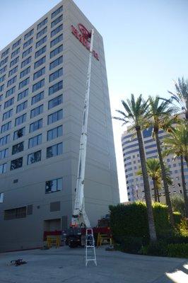 High rise sign repair. Internal lighting on part of the sign logo was off. Repaired like new.