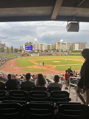 Behind home plate.