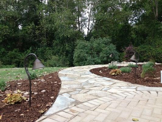 Flagstone walkway with Kichler lighting.