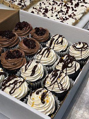 We offer a variety of cupcake and cake flavors. Shown are Vanilla Whiskey Fudge and Chocolate Berry.