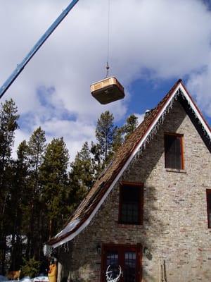 This is how we get a tub onto a second story deck.  The cost to rent the crane was only $300