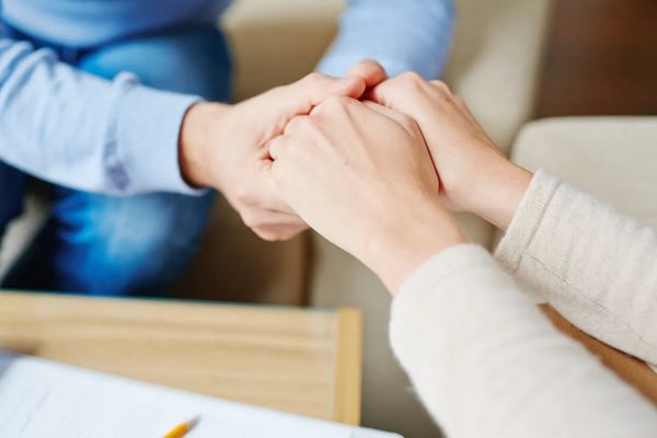 Supportive hands holding each other