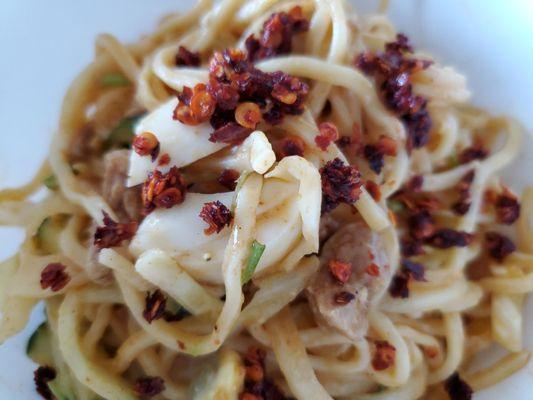 Hot chili flakes on the noodle salad