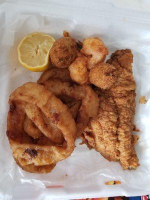 Super Combo 2 fish fillets(catfish,flounder or snapper) with Calamari  or clam strips, Fries,Hush Puppies or Onion Rings.