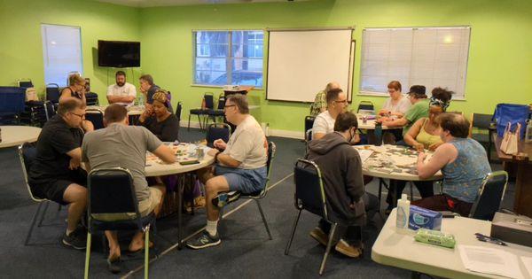 People playing board games at Tampa Gaming Guild.