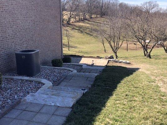 Beautiful stone stairway, turned a steep grassy slope into a beautiful landscape feature.