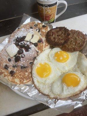 Blueberry pancake over easy eggs turkey sausage $12