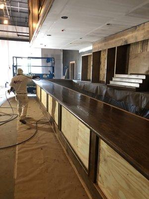 Staining and Varnishing all the wood inside the new Whiskey River in Richmond TX.