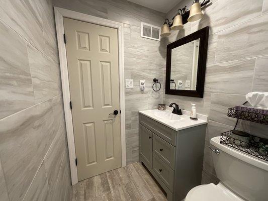 Recessed mirror with wider sink